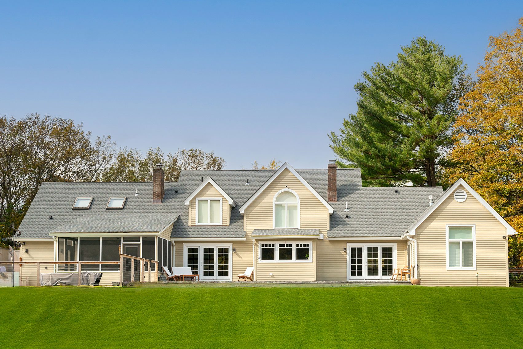 Cedar Lane residence in Rhinebeck, New York with warm wood and stone finishes