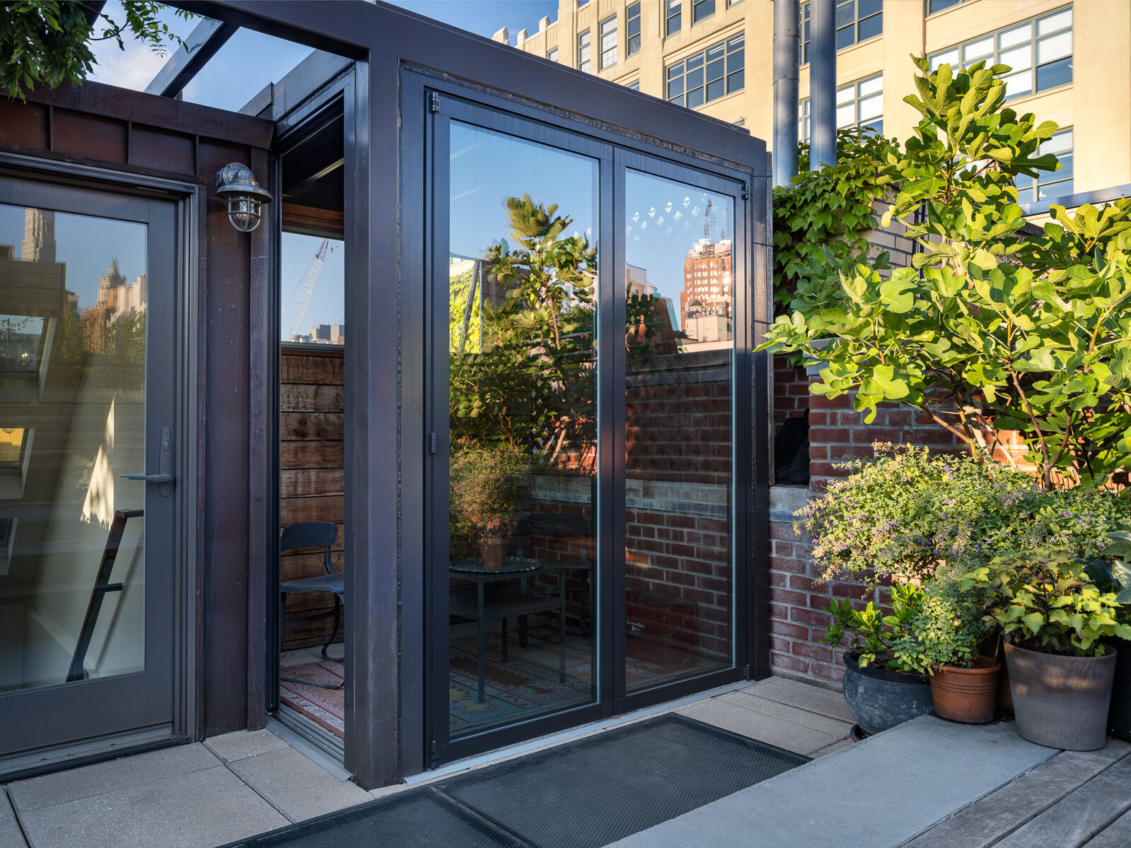 Tribeca rooftop terrace with built-in seating and skyline views — image 2 of 4