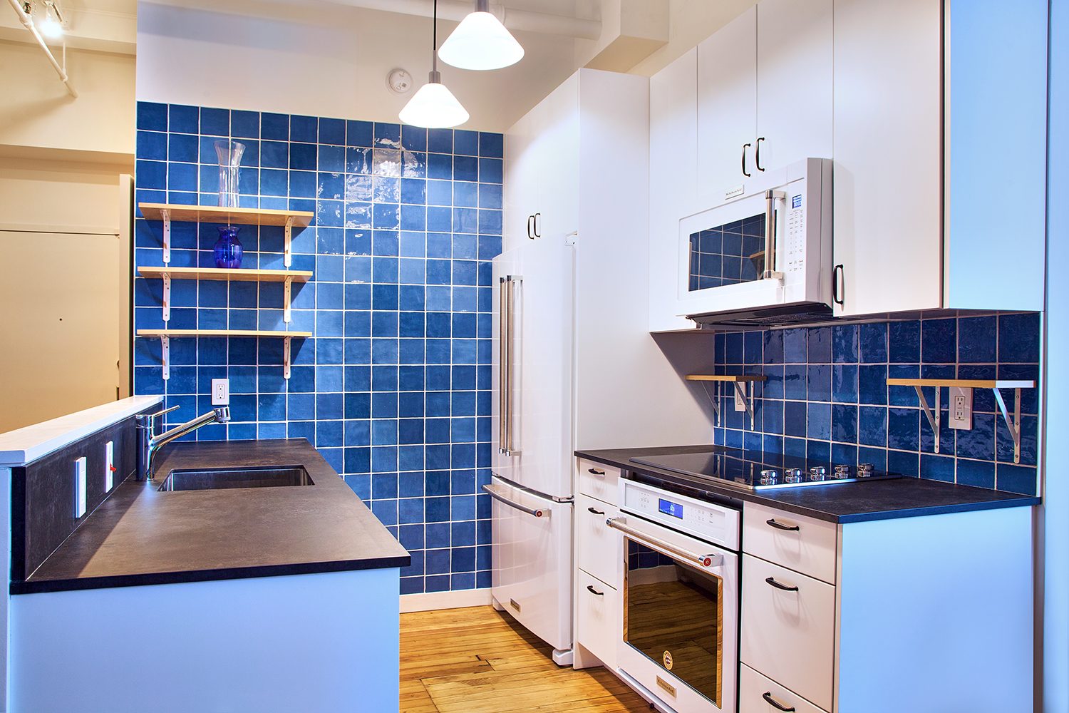 Flatiron District apartment renovation with custom cabinetry and stone surfaces