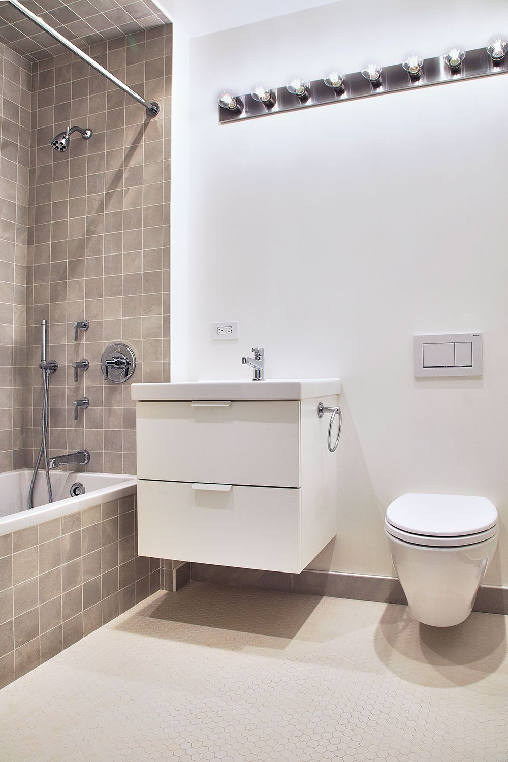Flatiron District apartment renovation with custom cabinetry and stone surfaces — image 7 of 10
