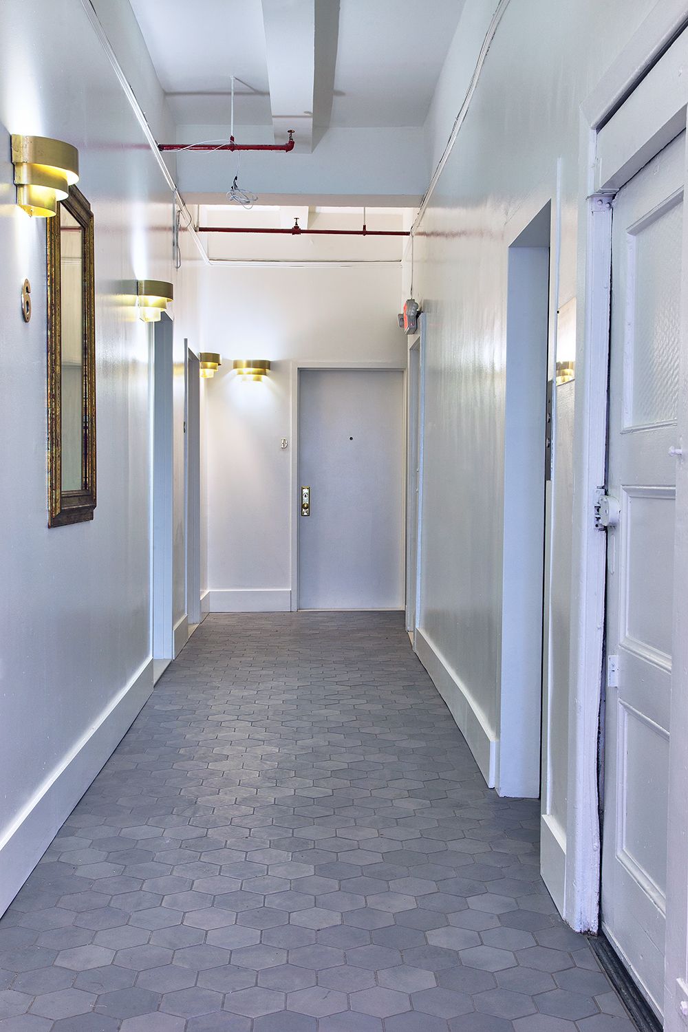 Flatiron District apartment renovation with custom cabinetry and stone surfaces — image 3 of 10