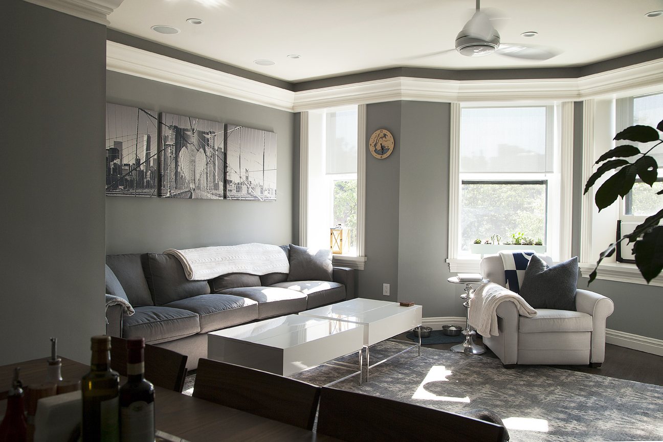 Cobble Hill project hallway with paneled wainscoting, crown moulding and framed artwork — image 2 of 7