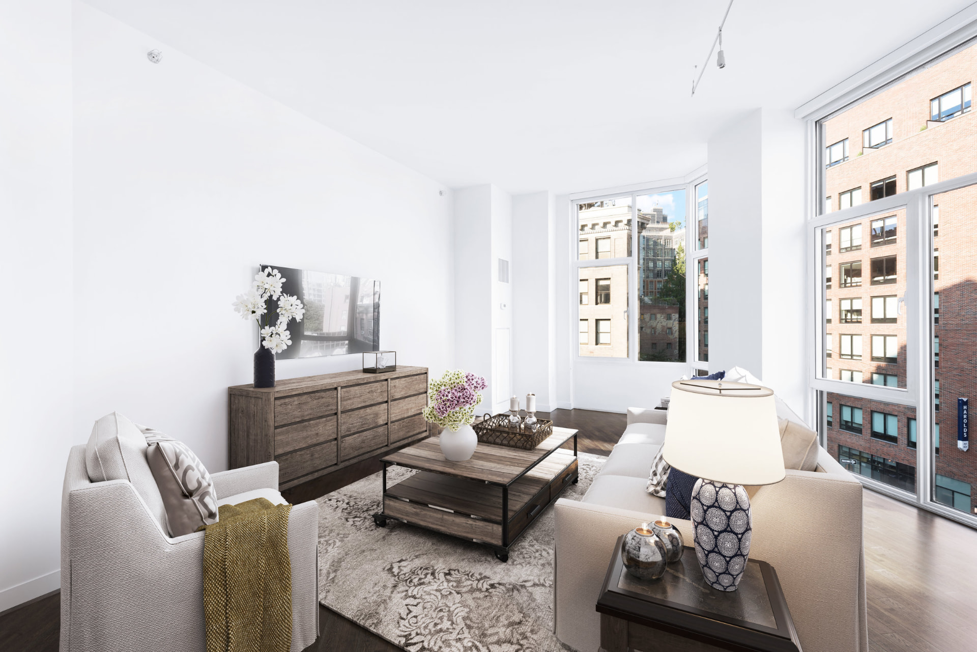 Tribeca II — dining room with a set table and upholstered chairs beside tall city-facing windows, with white built-in shelving and dark hardwood flooring — image 13 of 14