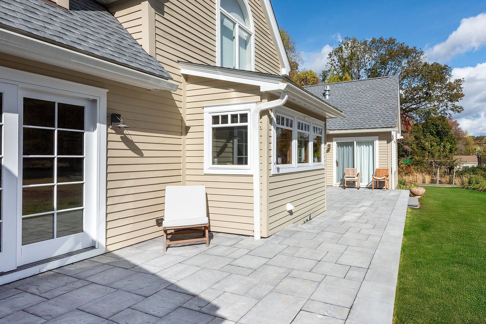 Cedar Lane residence in Rhinebeck, New York with warm wood and stone finishes — image 6 of 10