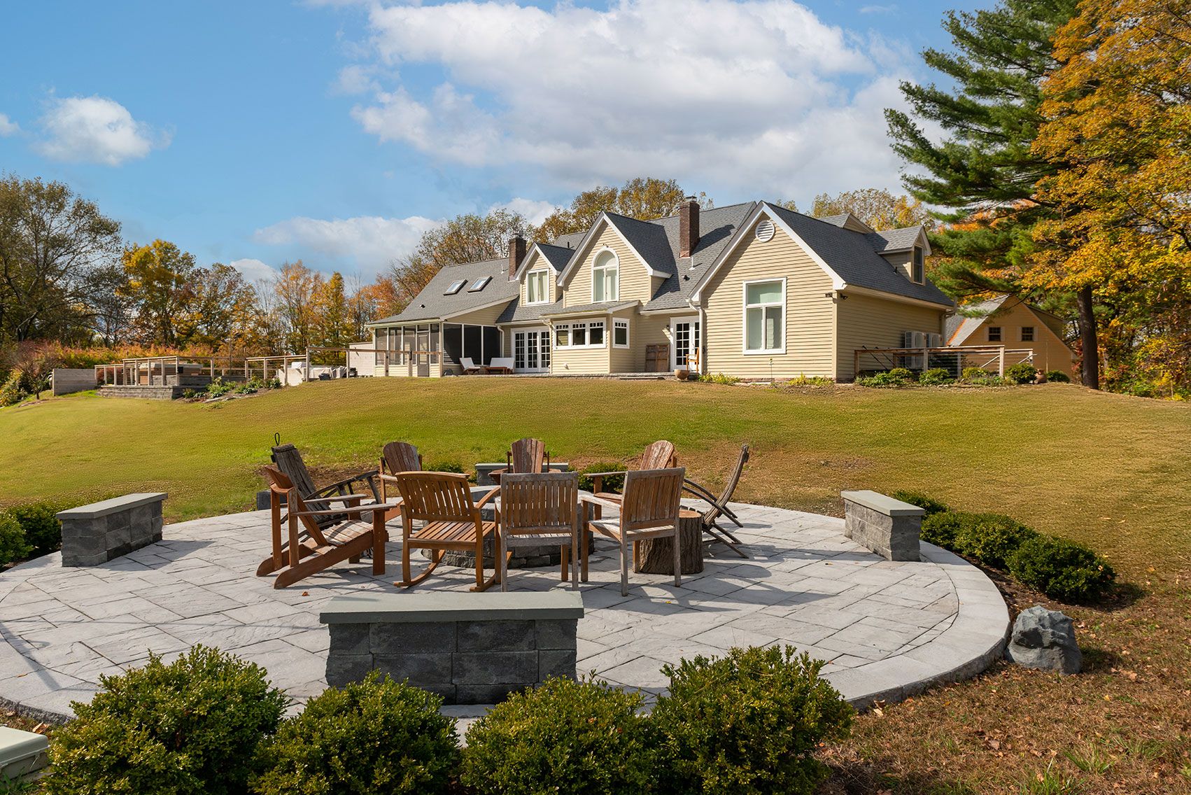 Cedar Lane residence in Rhinebeck, New York with warm wood and stone finishes — image 2 of 10
