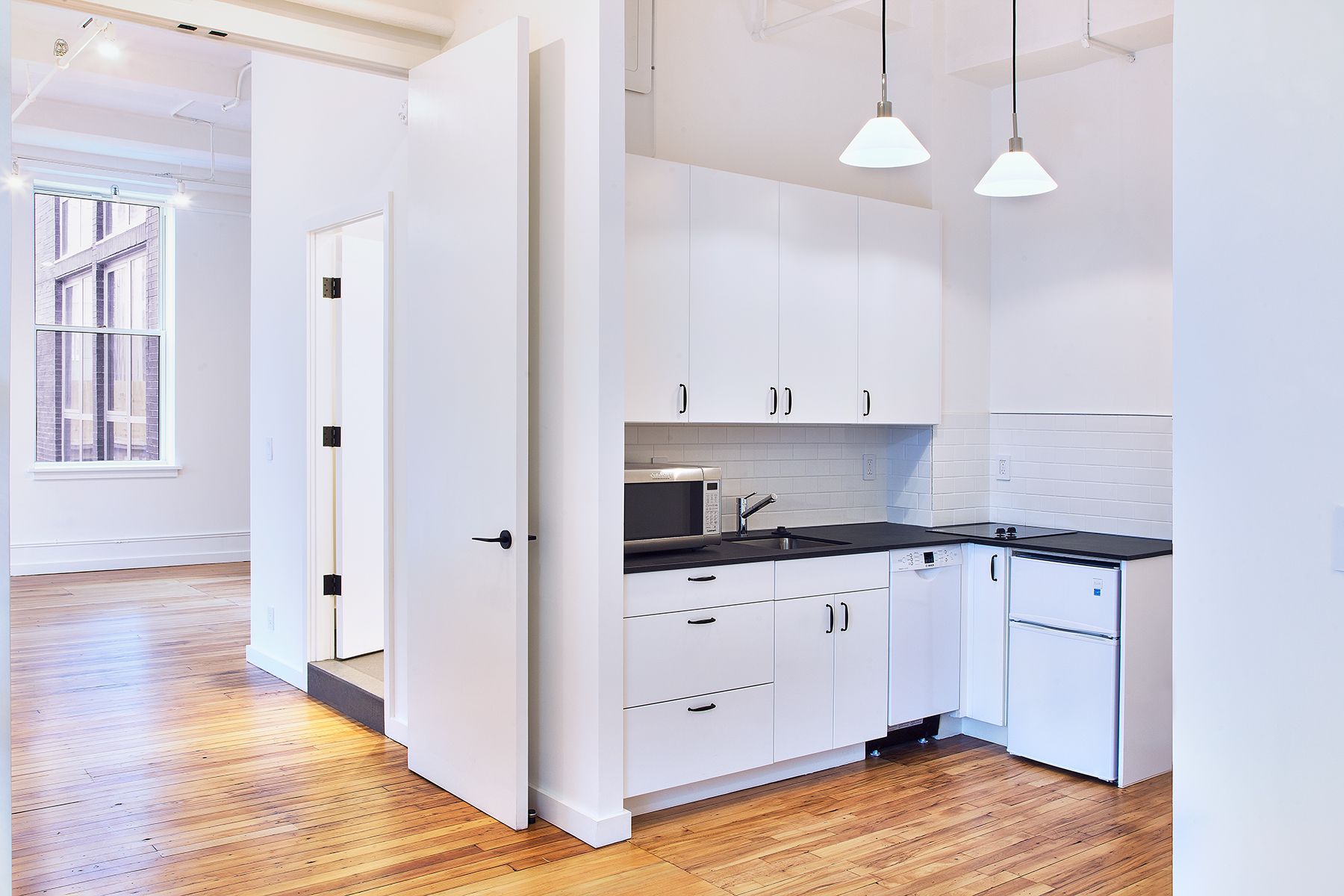 Flatiron District apartment renovation with custom cabinetry and stone surfaces — image 4 of 10