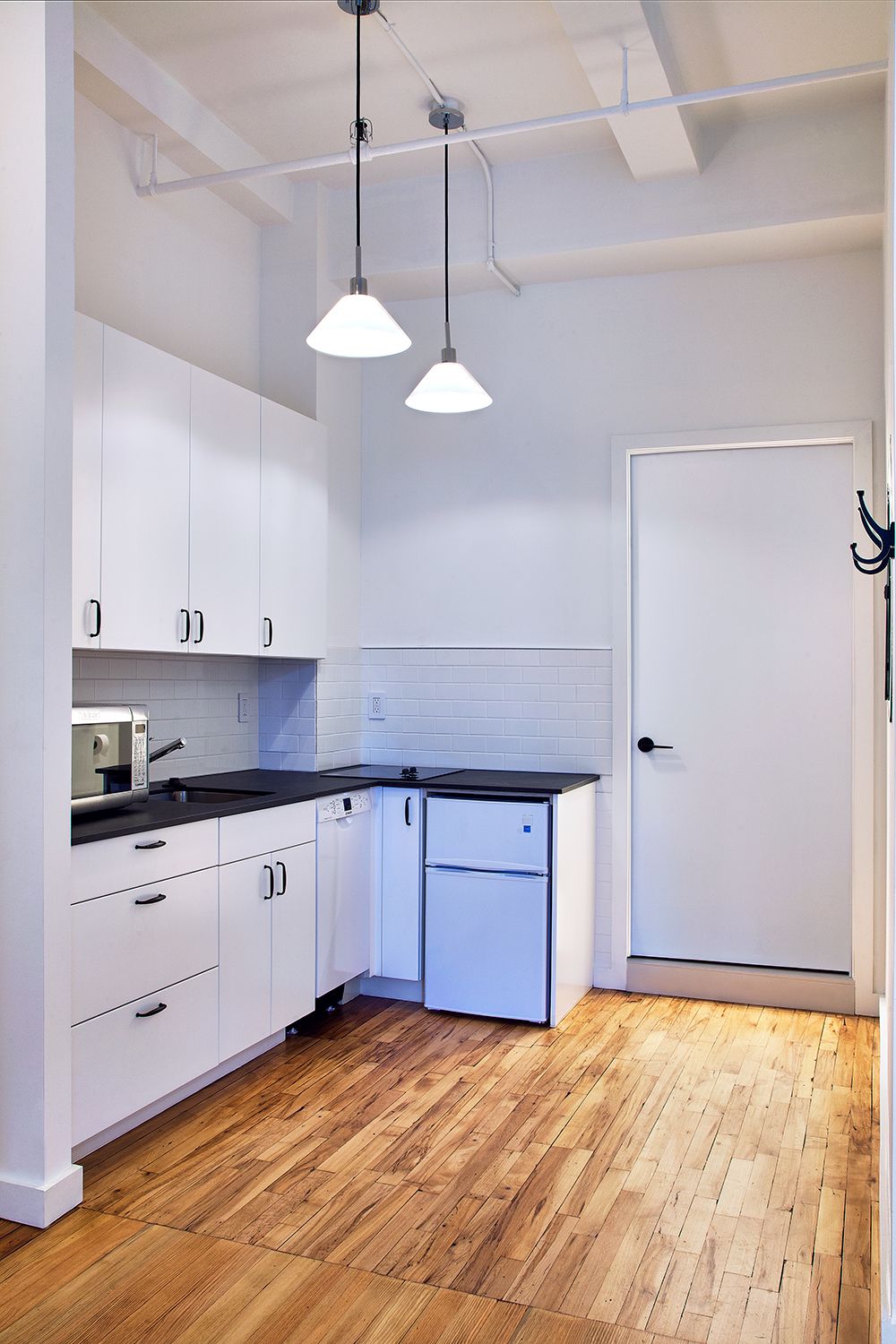 Flatiron District apartment renovation with custom cabinetry and stone surfaces — image 6 of 10