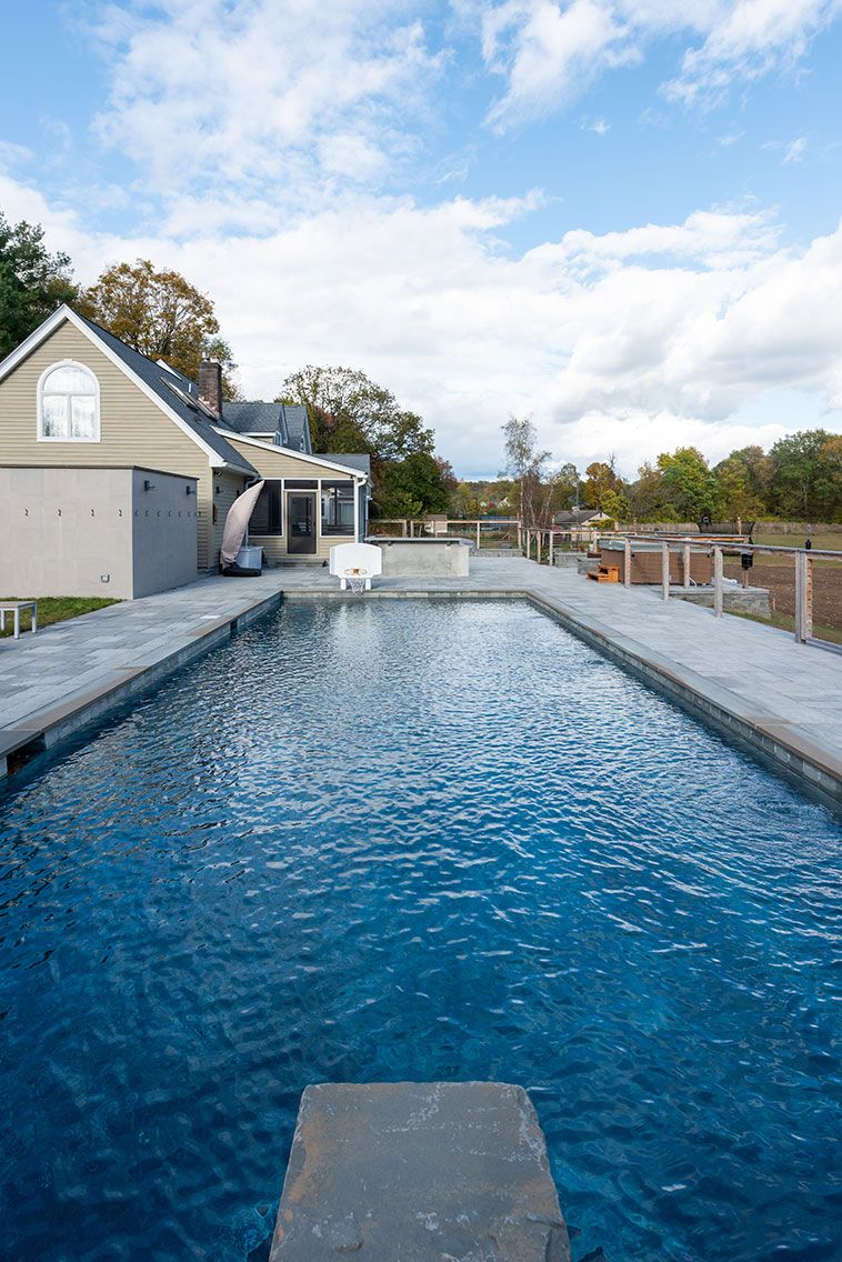 Cedar Lane residence in Rhinebeck, New York with warm wood and stone finishes — image 10 of 10