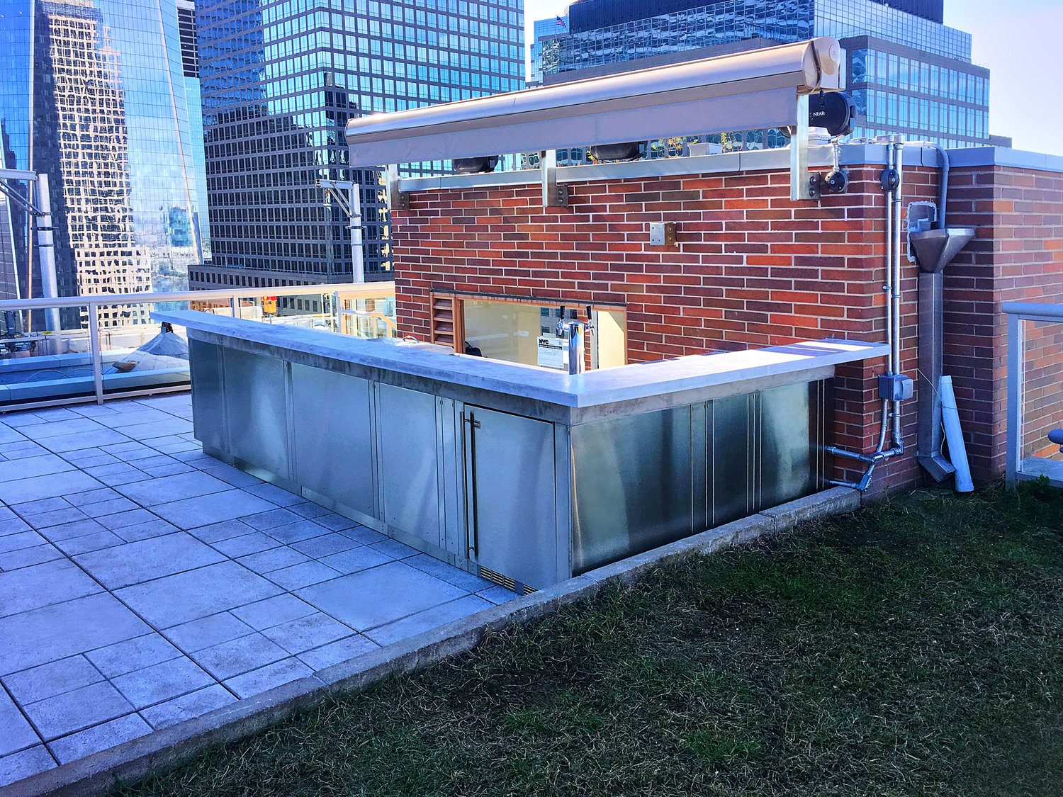 Battery Park City rooftop terrace with built-in seating and city views