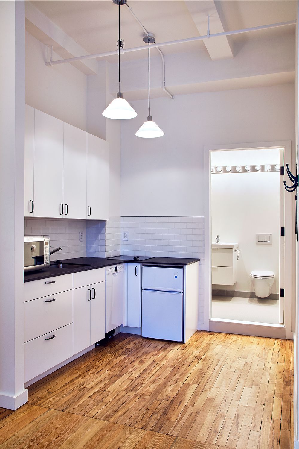 Flatiron District apartment renovation with custom cabinetry and stone surfaces — image 5 of 10